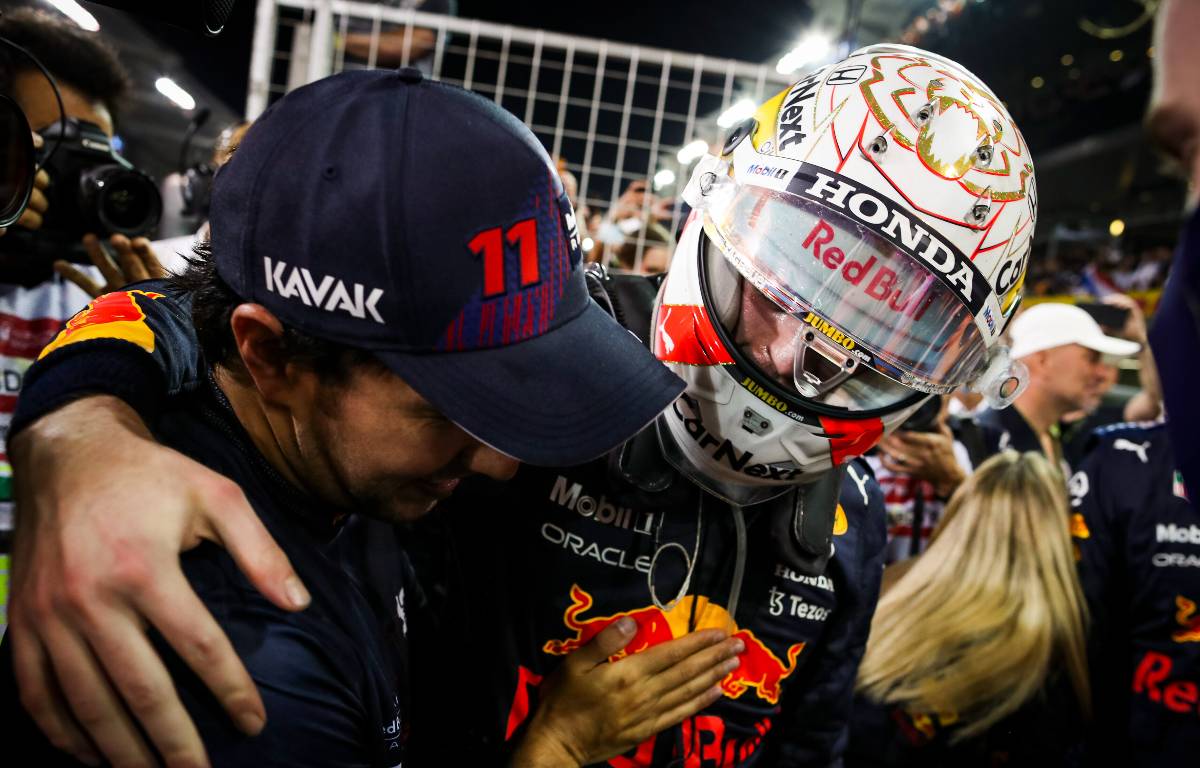 Red Bull team-mates Sergio Perez and Max Verstappen embrace. Abu Dhabi, December 2021.