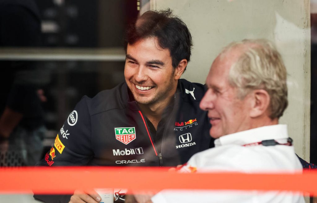 Sergio Perez smiles with Helmut Marko. Interlagos November 2021.