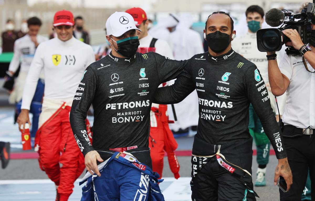 Valtteri Bottas and Lewis Hamilton walk together. Abu Dhabi December 2021.