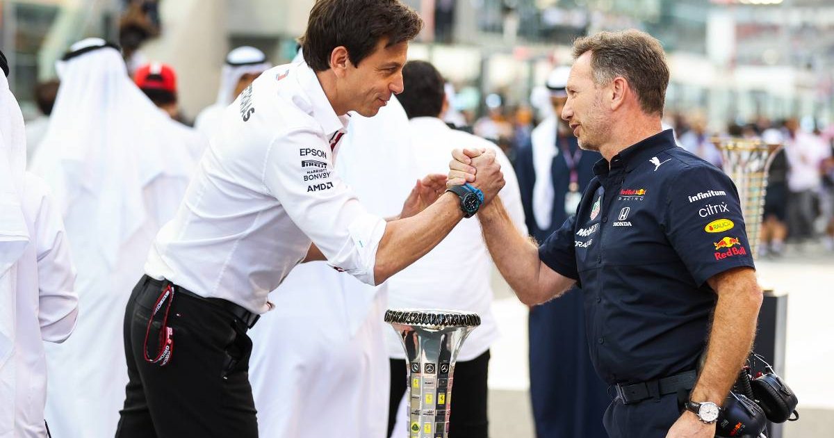 Toto Wolff and Christian Horner shake hands. Yas Marina December 2021.