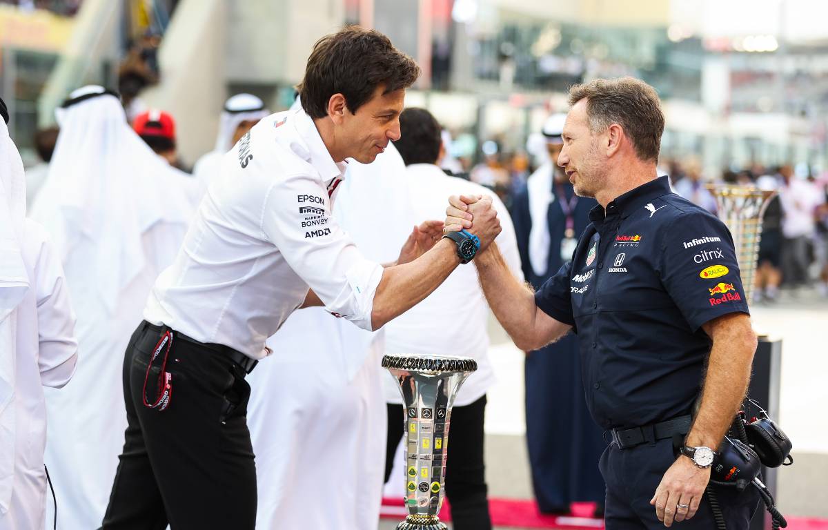 Toto Wolff and Christian Horner shake hands. Yas Marina December 2021.