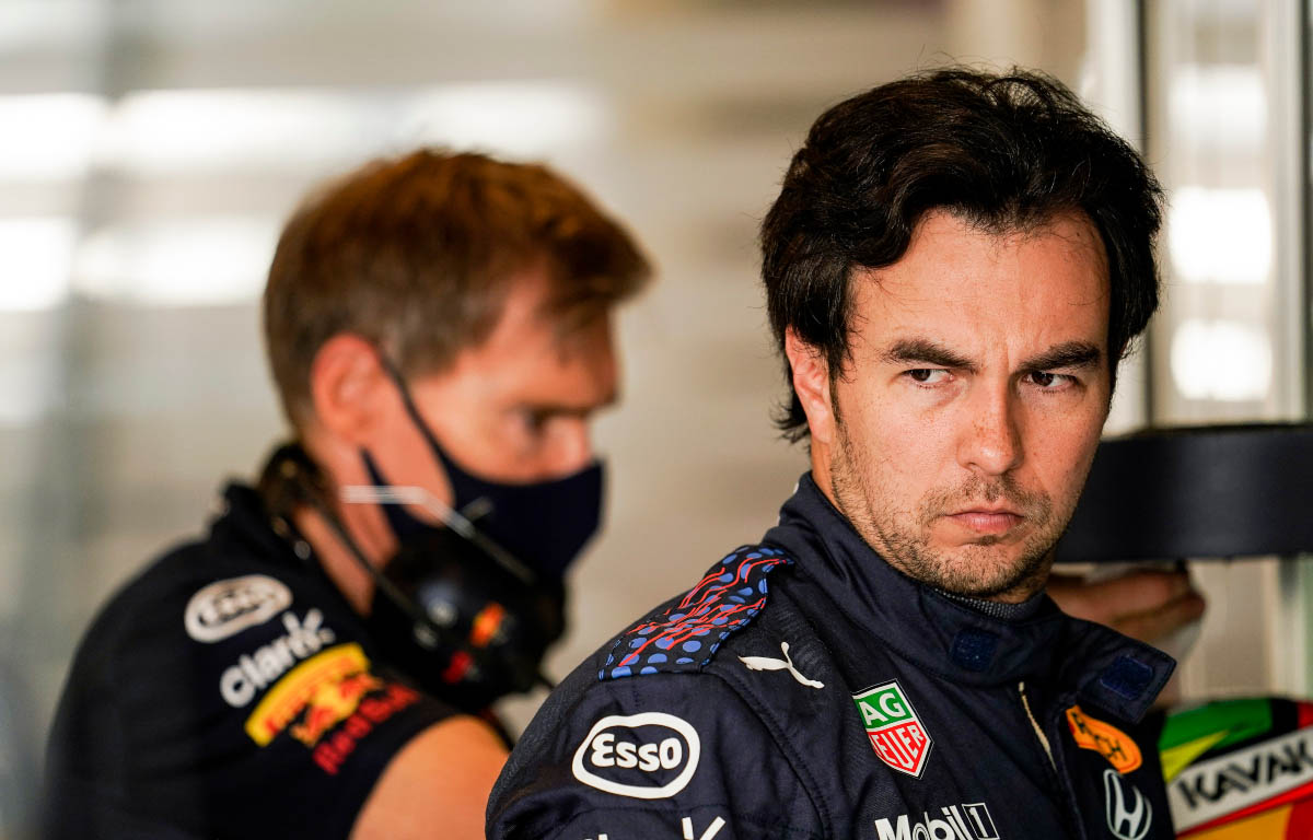 Sergio Perez looks on in the Red Bull garage. Abu Dhabi December 2021.