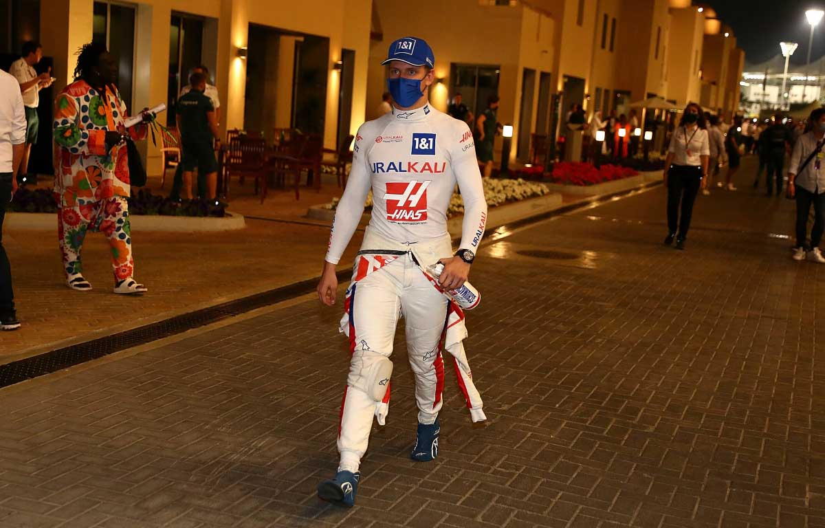 Mick Schumacher walks through the paddock. Abu Dhabi December 2021.