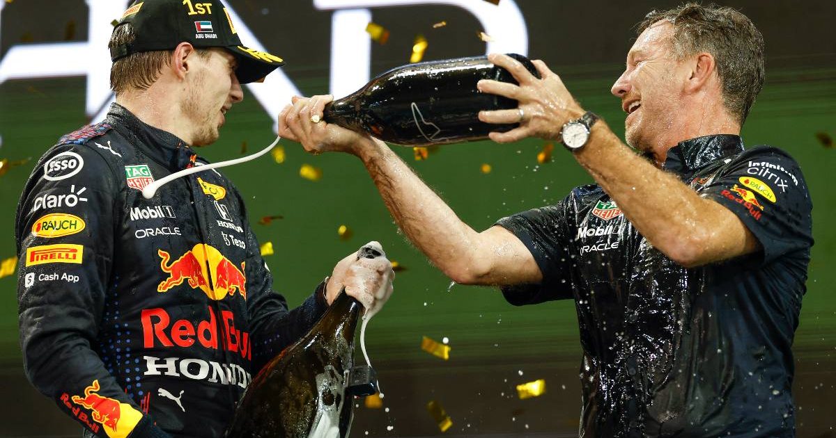 Christian Horner pours champagne on Max Verstappen. Abu Dhabi December 2021.