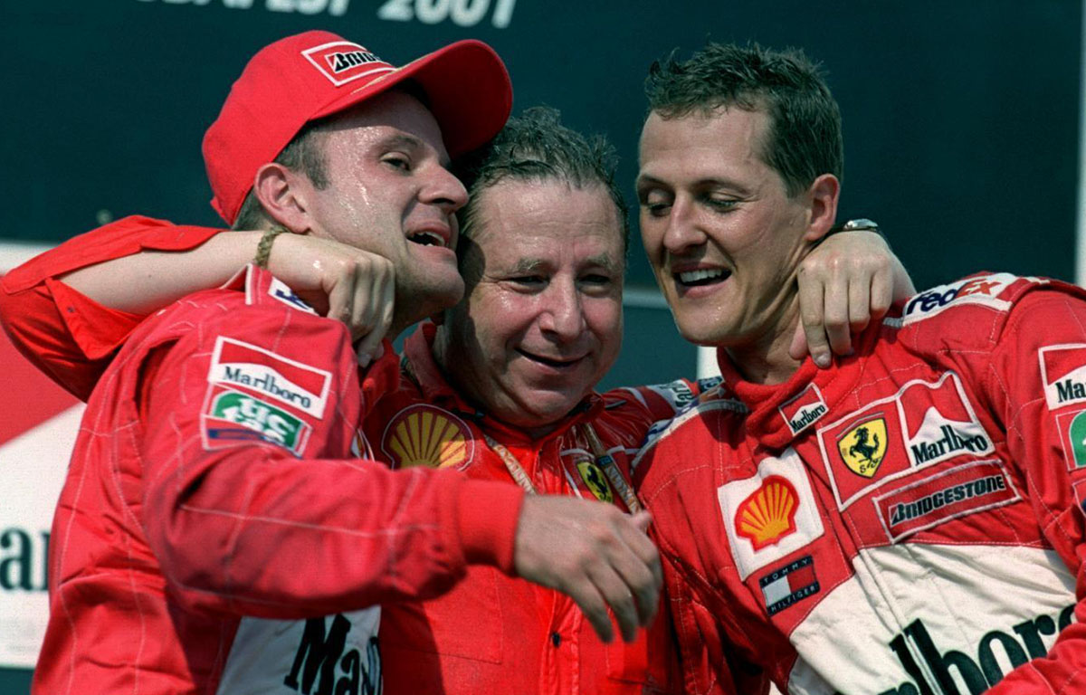 Jean Todt on the podium with Michael Schumacher and Rubens Barrichello. Hungary 2001