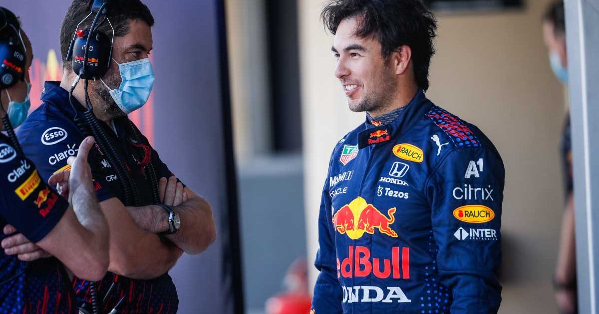 Sergio Perez smiles in the pit lane. Abu Dhabi December 2021.