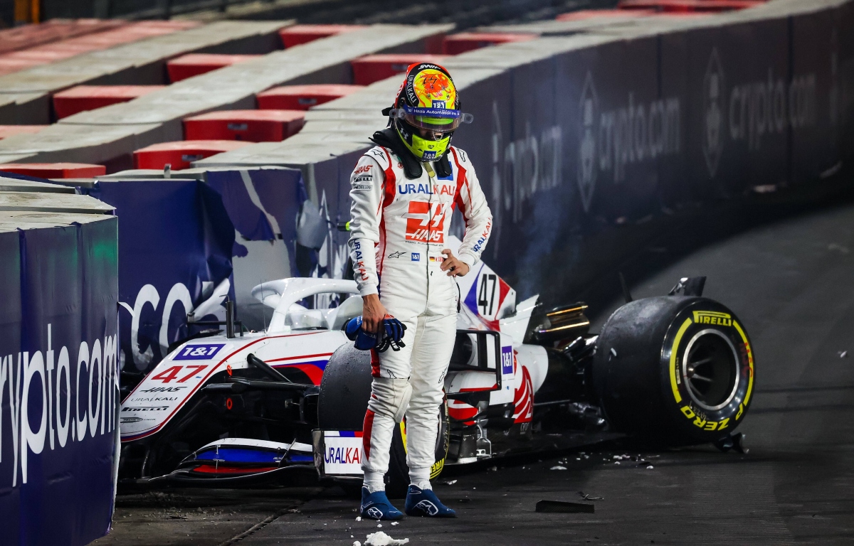 Mick Schumacher with his crashed Haas behind him. Saudi Arabia December 2021