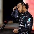 Lewis Hamilton mops his head with a towel after the Abu Dhabi GP. Yas Marina December 2021.