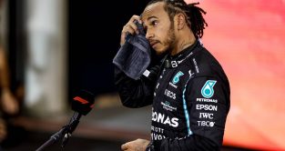 Lewis Hamilton mops his head with a towel after the Abu Dhabi GP. Yas Marina December 2021. Heartbreak