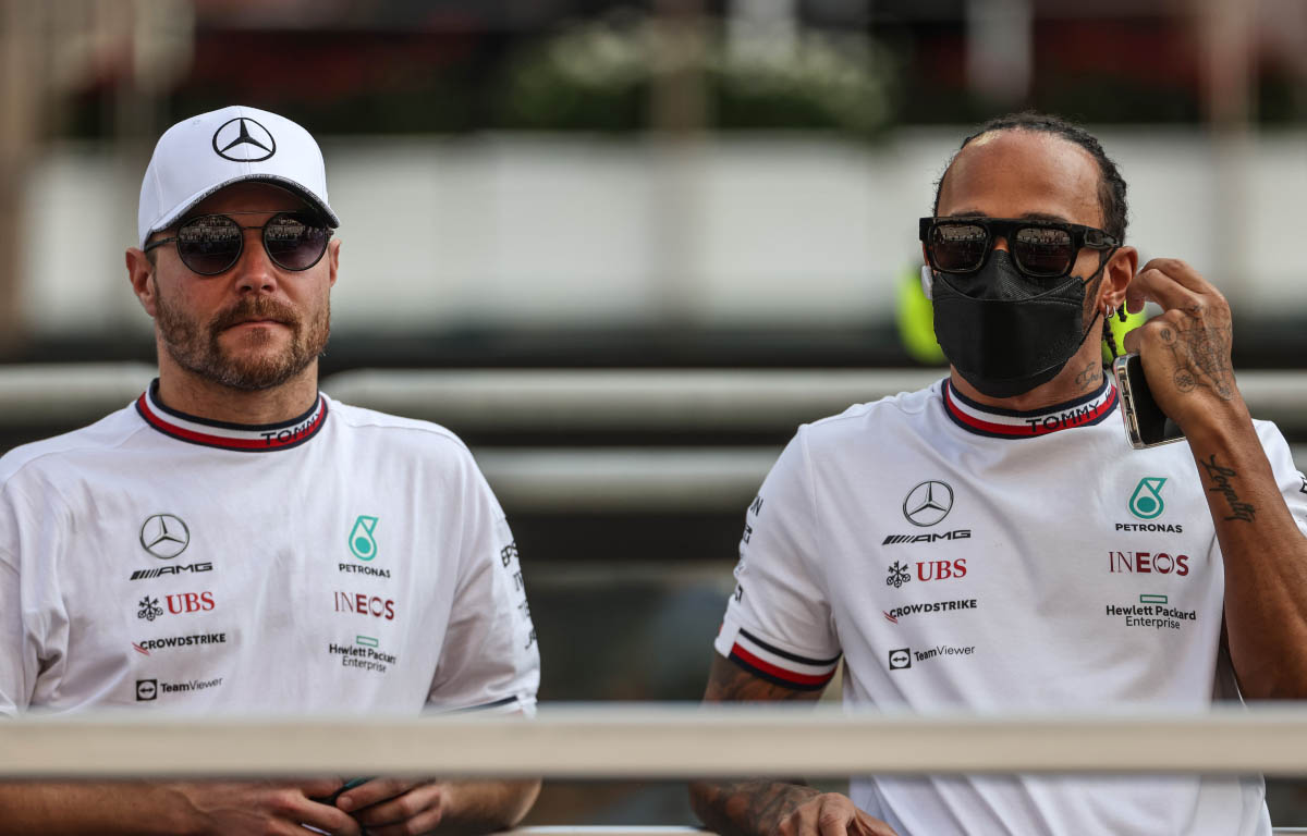 Valtteri Bottas and Lewis Hamilton stand side-by-side. Abu Dhabi December 2021.