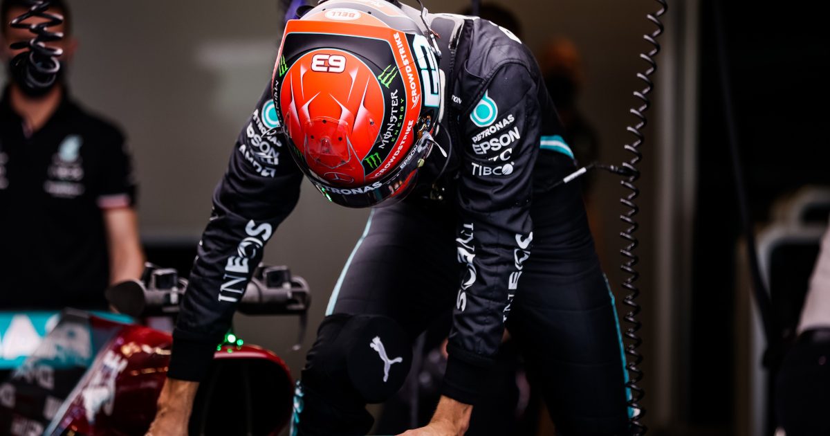 George Russell climbs into the 2021 Mercedes. Abu Dhabi December 2021