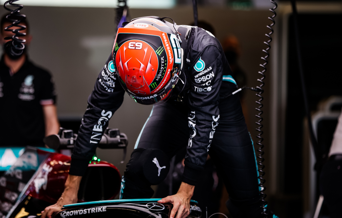 George Russell climbs into the 2021 Mercedes. Abu Dhabi December 2021