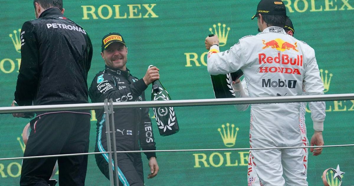 Valtteri Bottas and Sergio Perez raise bottles on the podium. Turkey, October 2021.