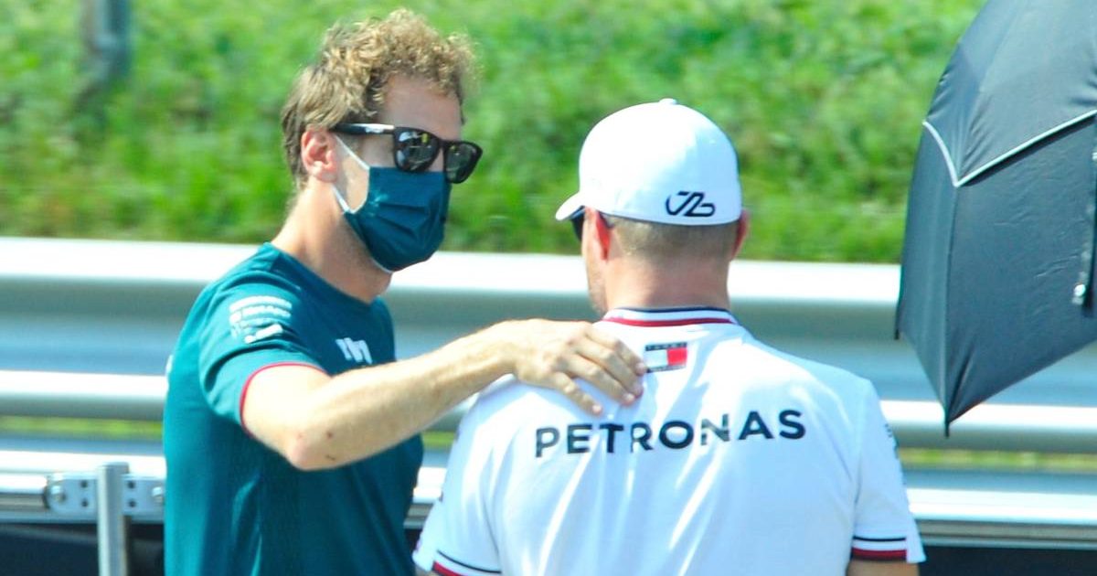 Sebastian Vettel with his hand on Valtteri Bottas' shoulder. Monza September 2021.