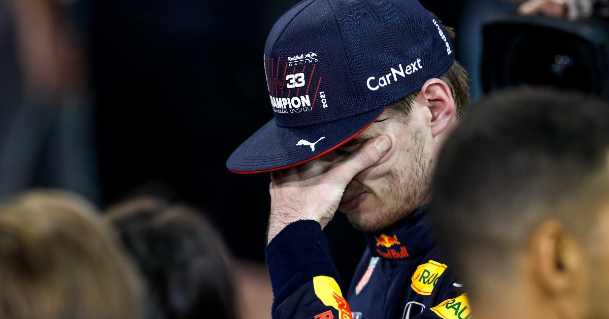 Max Verstappen with his hand over his eyes. Abu Dhabi, December 2021.