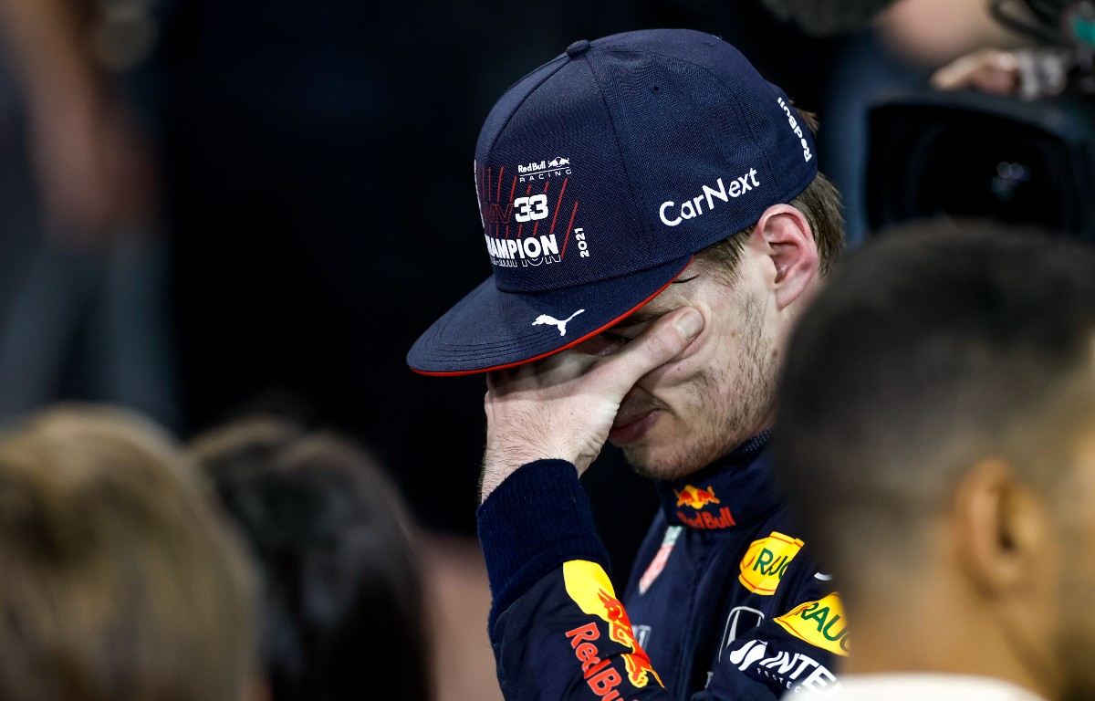 Max Verstappen with his hand over his eyes. Abu Dhabi, December 2021.
