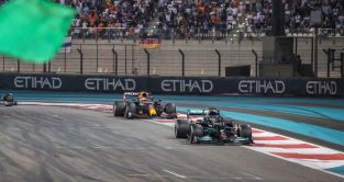 Lewis Hamilton and Max Verstappen start final lap. FIA F1 Abu Dhabi December 2021