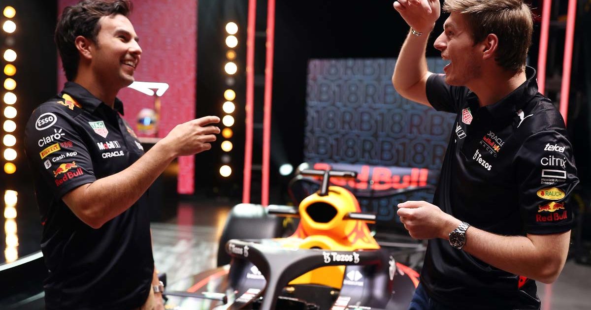 Sergio Perez and Max Verstappen share a joke. Red Bull RB18 launch February 2022.