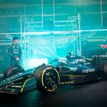 Sebastian Vettel and Lance Stroll stand with the AMR22. February 2022.