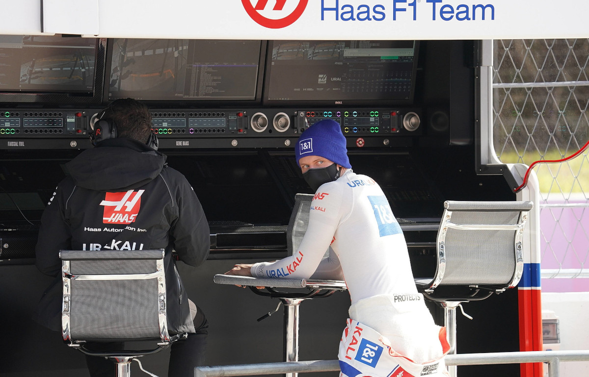 Mick Schumacher speaking to the team on Haas pit wall in testing. Barcelona February 2022