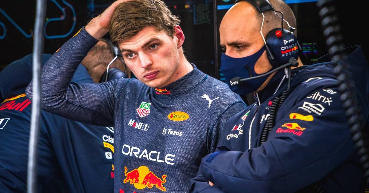 Max Verstappen puts his hand to his head. Spain, February 2022.