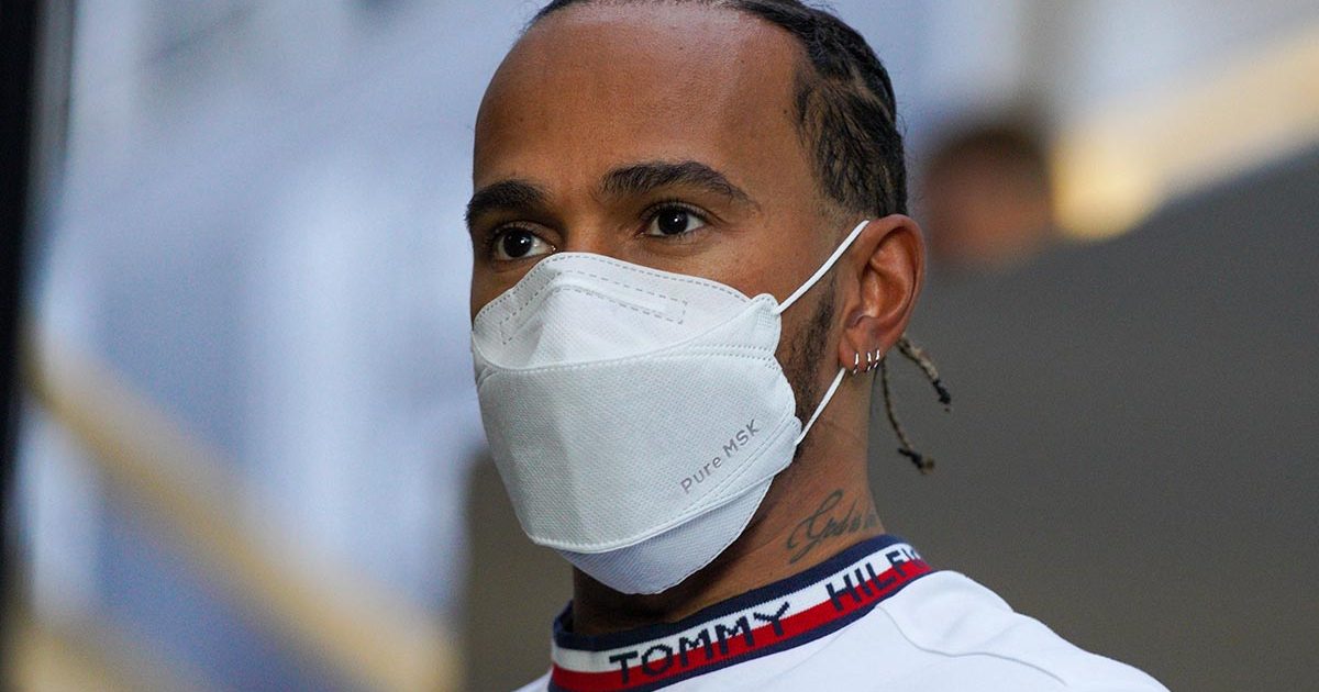 Lewis Hamilton watches on from the paddock. Barcelona February 2022