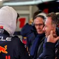 Christian Horner speaking with Max Verstappen, Helmut Marko in the background. Barcelona February 2022
