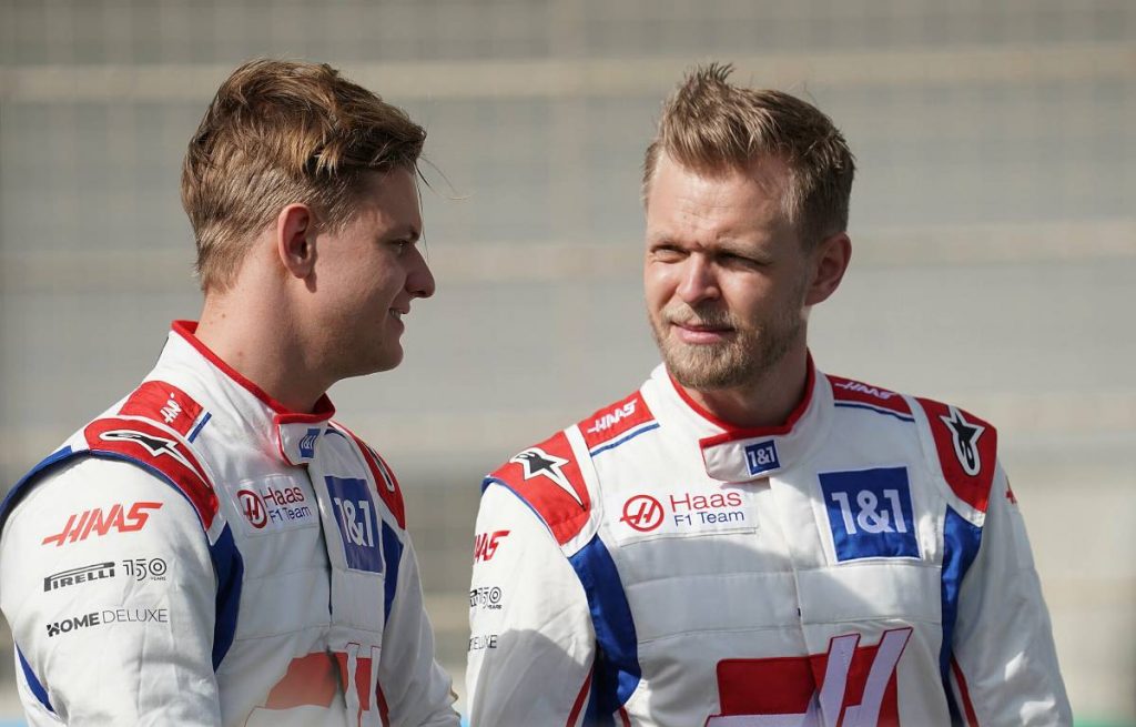 Kevin Magnussen talks to Mick Schumacher. Bahrain March 2022.