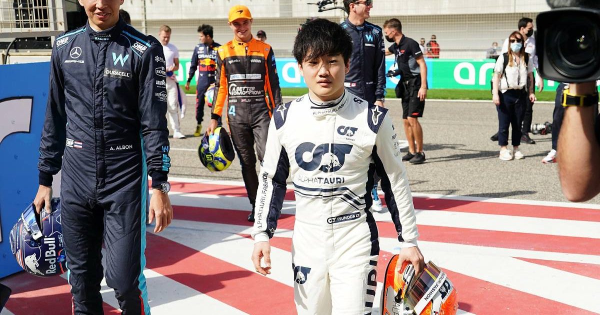 Yuki Tsunoda walking alongside Alex Albon. Bahrain March 2022.