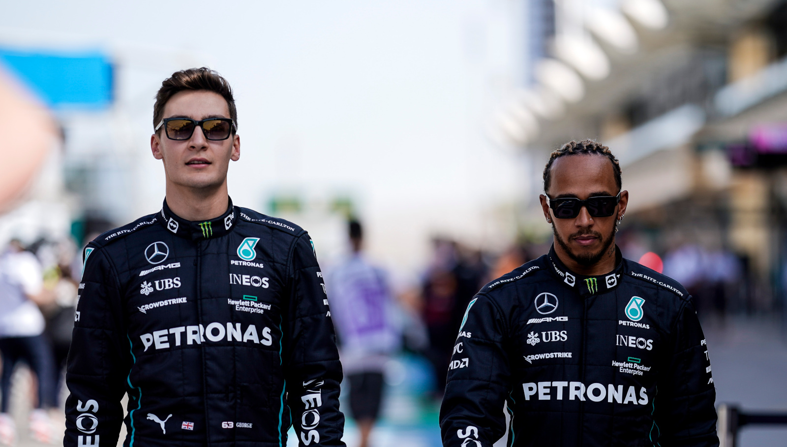 George Russell walking side by side with Lewis Hamilton. Bahrain March 2022