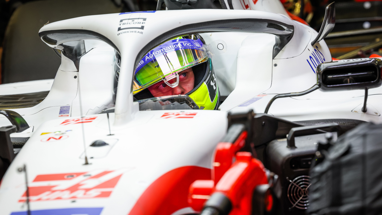 Mick Schumacher sitting in the Haas VF-22 in the garage. Bahrain March 2022