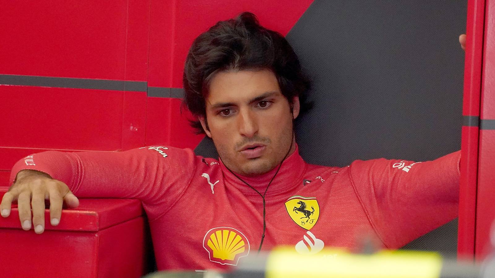 Carlos Sainz slouched in the Ferrari garage. Bahrain, March 2022.