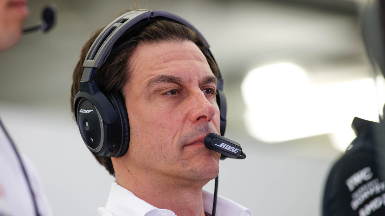 Toto Wolff wears a headset in the garage. Bahrain March 2022.