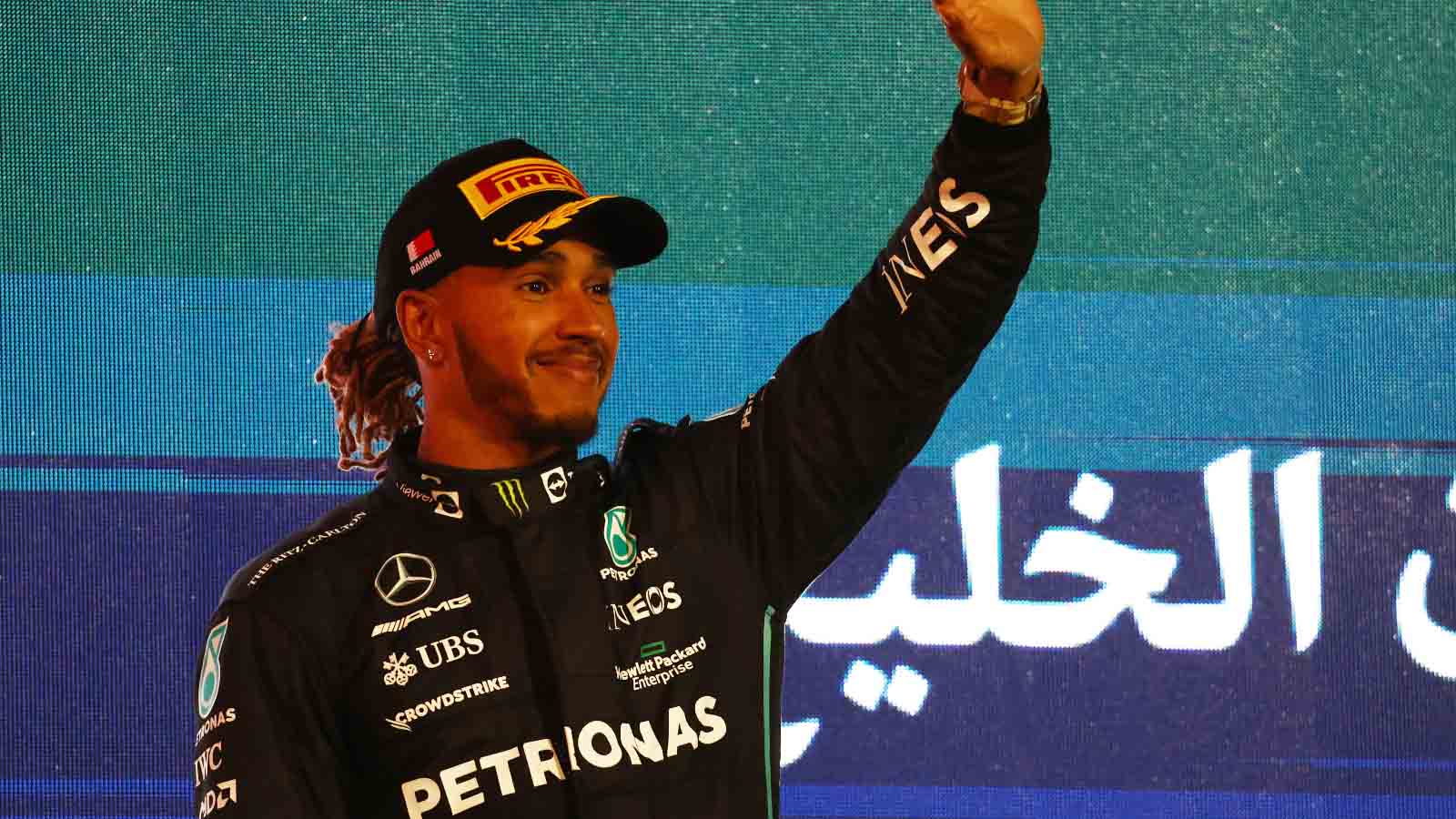 Lewis Hamilton waves on the podium. Bahrain March 2022.