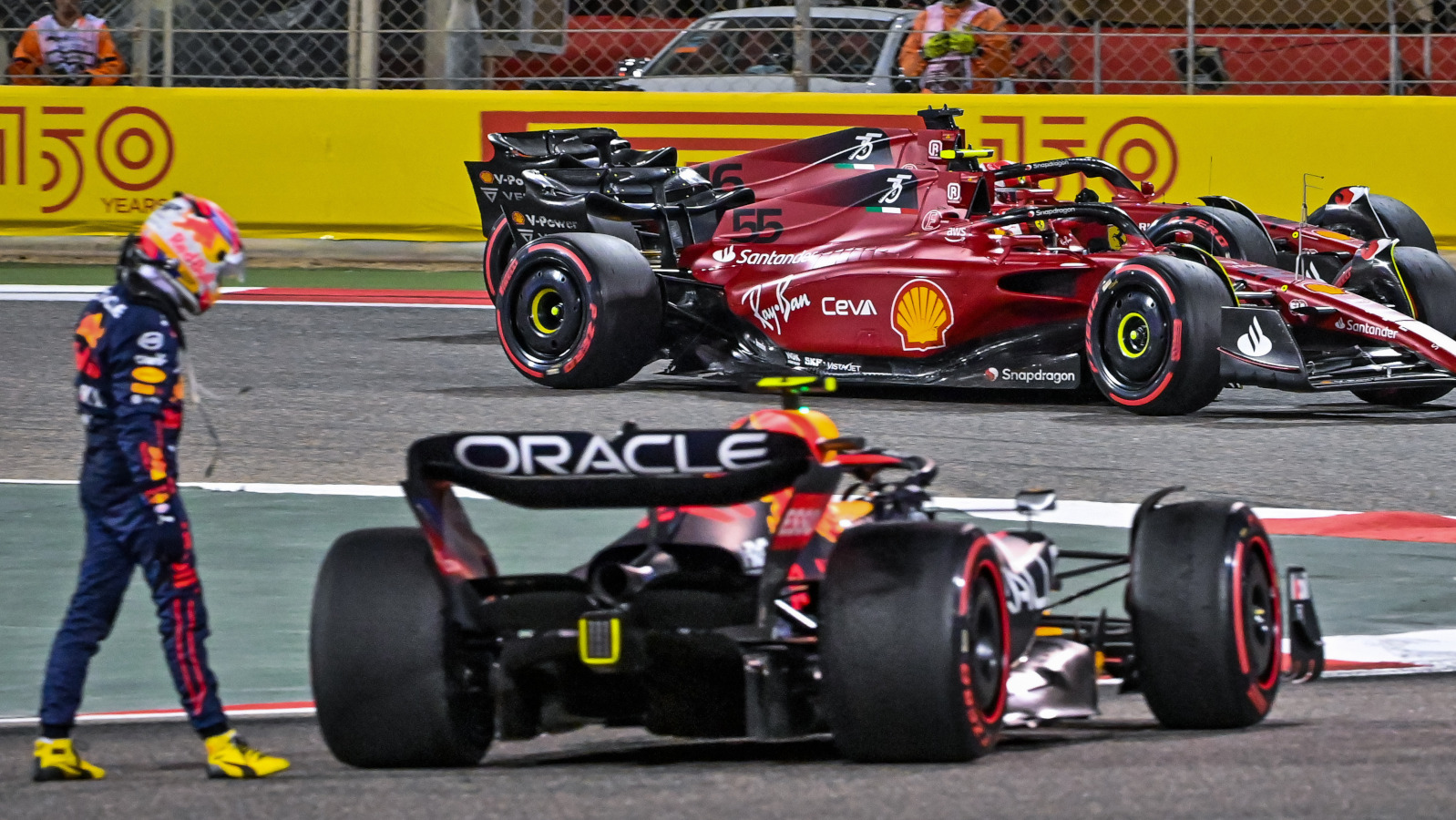 Red Bull driver Sergio Perez stopped with the Ferraris in the background. Bahrain March 2022