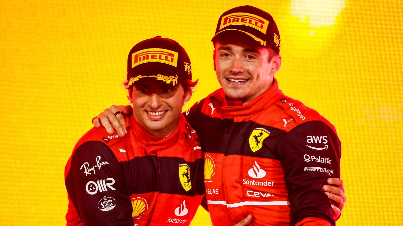 Charles Leclerc and Carlos Sainz hug on Bahrain podium. Bahrain 2022