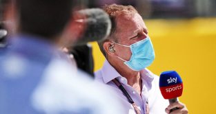 Martin Brundle speaks into a Sky Sports microphone at the British GP. August 2020.
