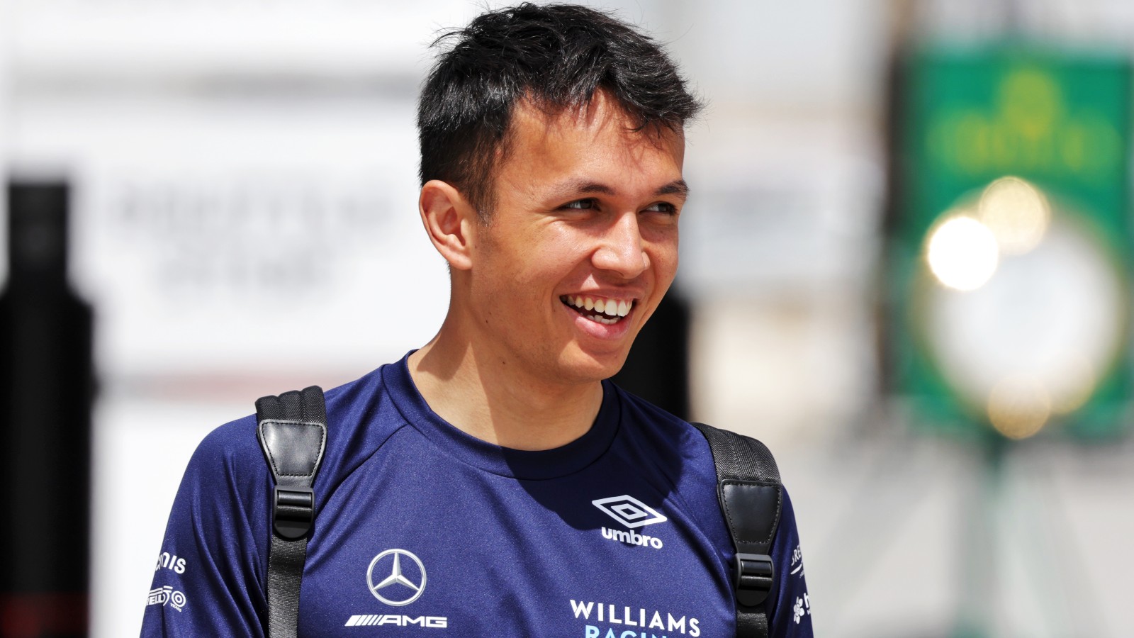 Alex Albon, Williams, smiling in the paddock. Bahrain, March 2022.