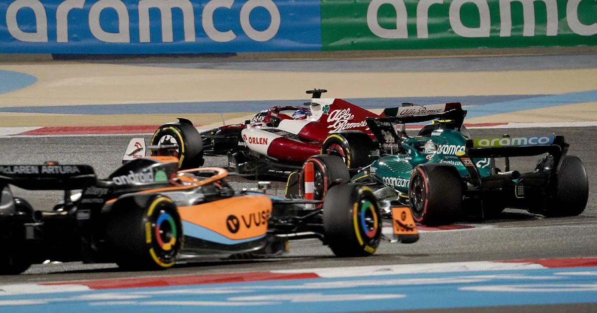 A McLaren and an Aston Martin follow an Alfa Romeo. Bahrain March 2022.