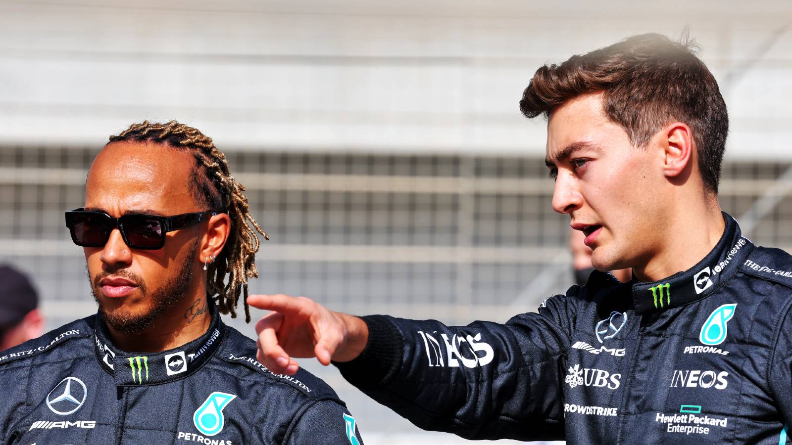 George Russell points something out to Lewis Hamilton. Bahrain March 2022.