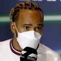 Lewis Hamilton, Mercedes, talks into a microphone. Saudi Arabia March 2022.