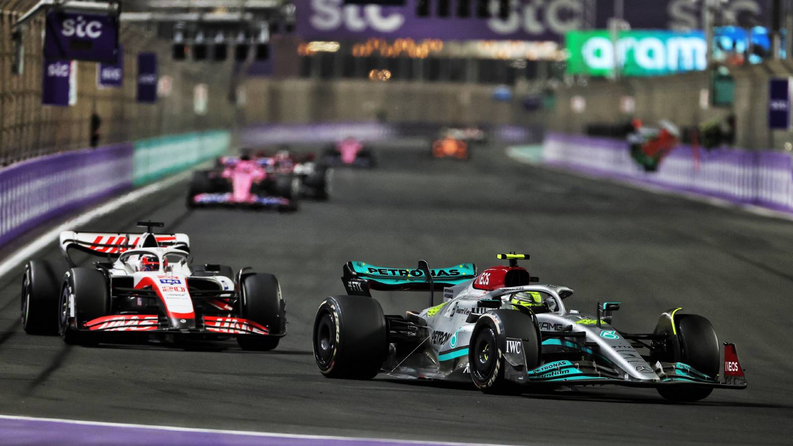 Lewis Hamilton ahead of Kevin Magnussen during the Saudi Arabian GP. Jeddah March 2022.