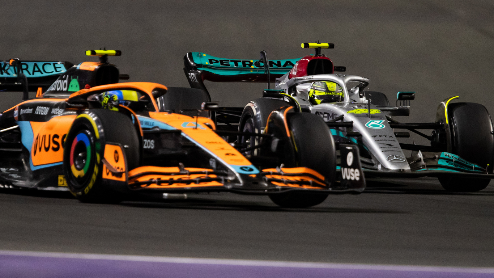 Lando Norris and Lewis Hamilton racing. Saudi Arabia March 2022