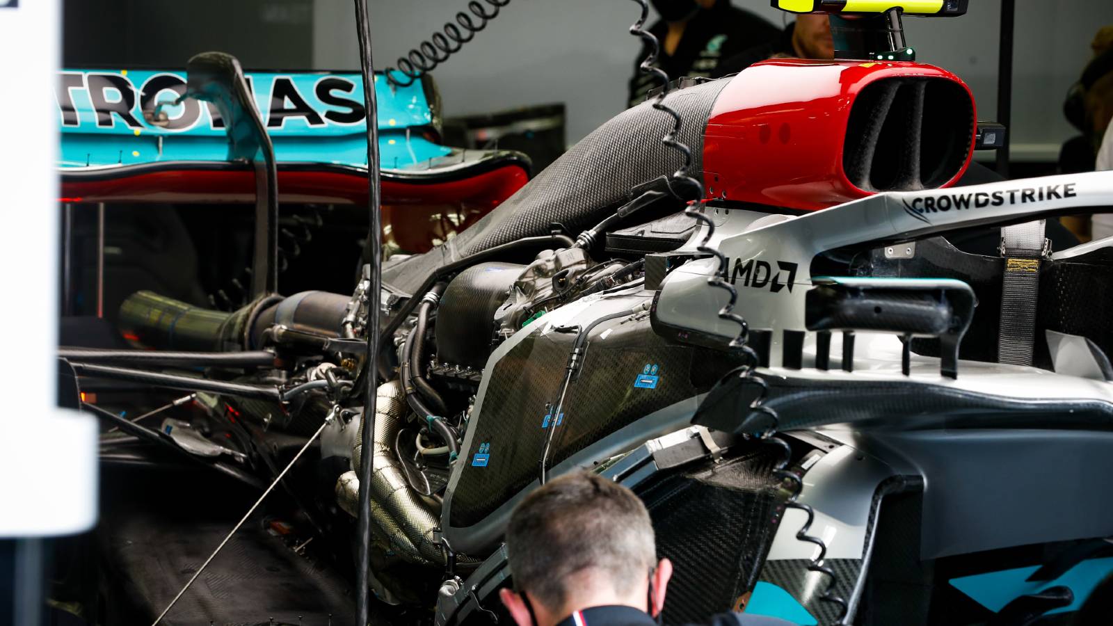 A Mercedes engineer works on the car. Bahrain March 2022.