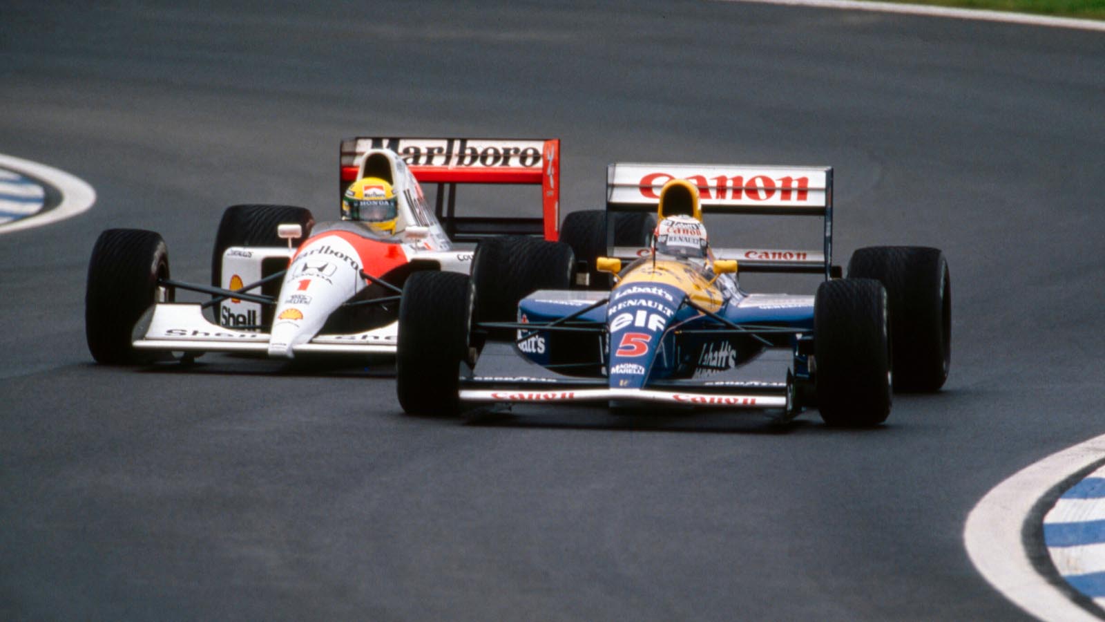 Nigel Mansell guida Ayrton Senna.  Barcellona, ​​settembre 1991.