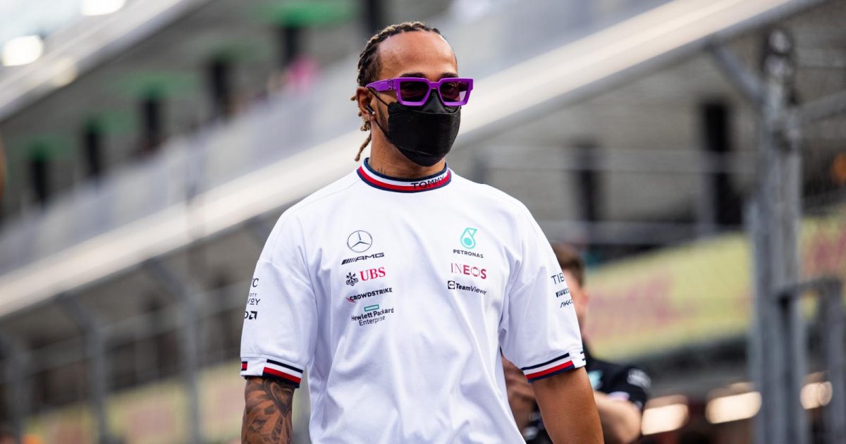 Lewis Hamilton walks through the pits. Jeddah March 2022.