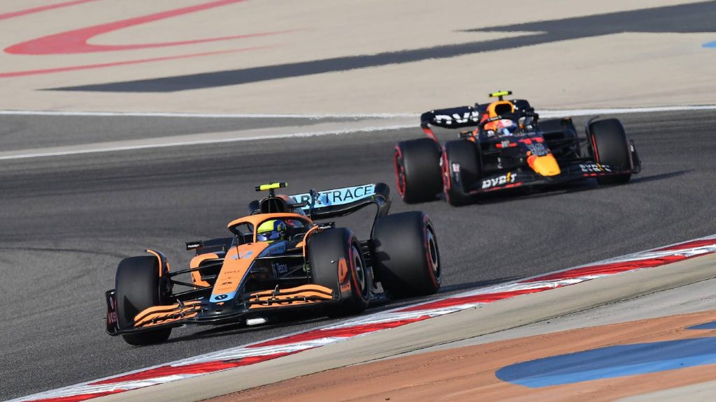Lando Norris' McLaren ahead of Sergio Perez's Red Bull. Bahrain March 2022.