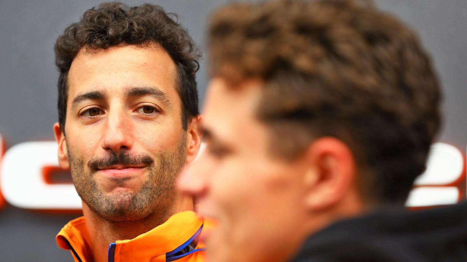 Daniel Ricciardo looks at McLaren team-mate Lando Norris. Brazil November 2021.