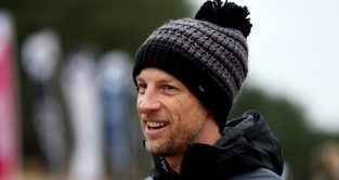 Jenson Button, wearing a bobble hat and jacket, smiling. England December 2021.