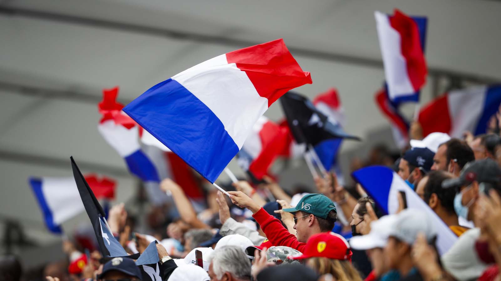 A fan waves a French flag. Paul Ricard June 2021.